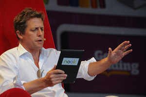 Hugh Grant reads for the crowds at the Get Reading Festival